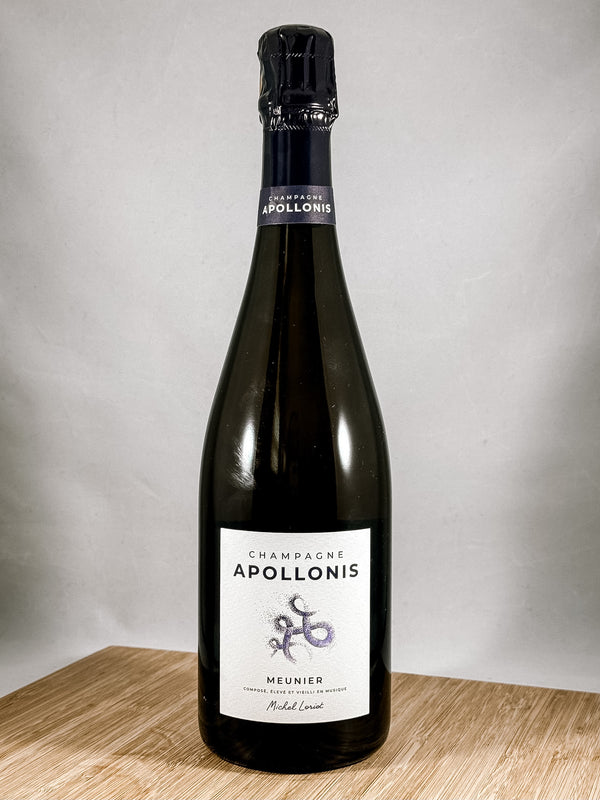 A bottle of Apollonis Meunier Champagne. Part of our monthly champagne club subscription