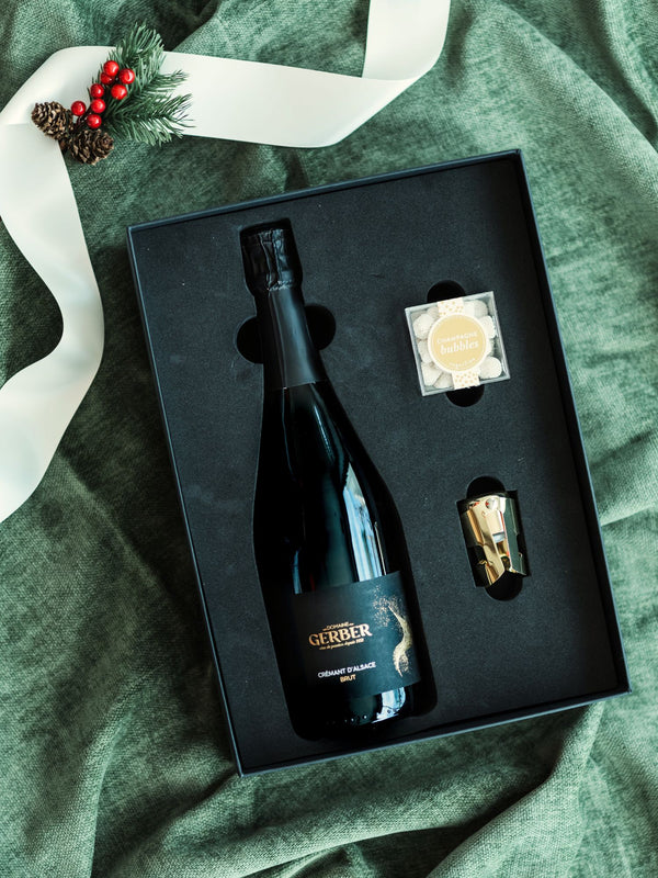 The perfect gift to say "Cheers" for every occasion. Our "Cheers Gift Bundle" includes a bottle of boutique bubbles, a SugarFina candy cube, gold champagne stopper and tasting notes.