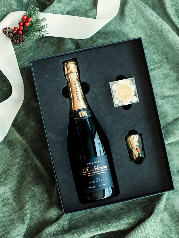 The perfect gift to say "Cheers" for every occasion. Our "Cheers Gift Bundle" includes a bottle of boutique bubbles, a SugarFina candy cube, gold champagne stopper and tasting notes.