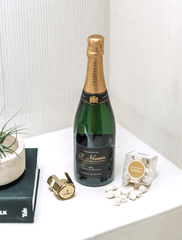 The perfect gift&nbsp;to say "Cheers" for every occasion. Our "Cheers Gift Bundle" includes a bottle of boutique bubbles, a SugarFina candy cube, gold champagne stopper and tasting notes.