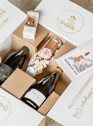 Our Bubbles 101 gift set is the perfect gift for any occasion for any bubbles lover! This set includes a selection of three small-batch, boutique sparkling wines, a rose gold champagne stopper and our Bubbles 101 Booklet.  